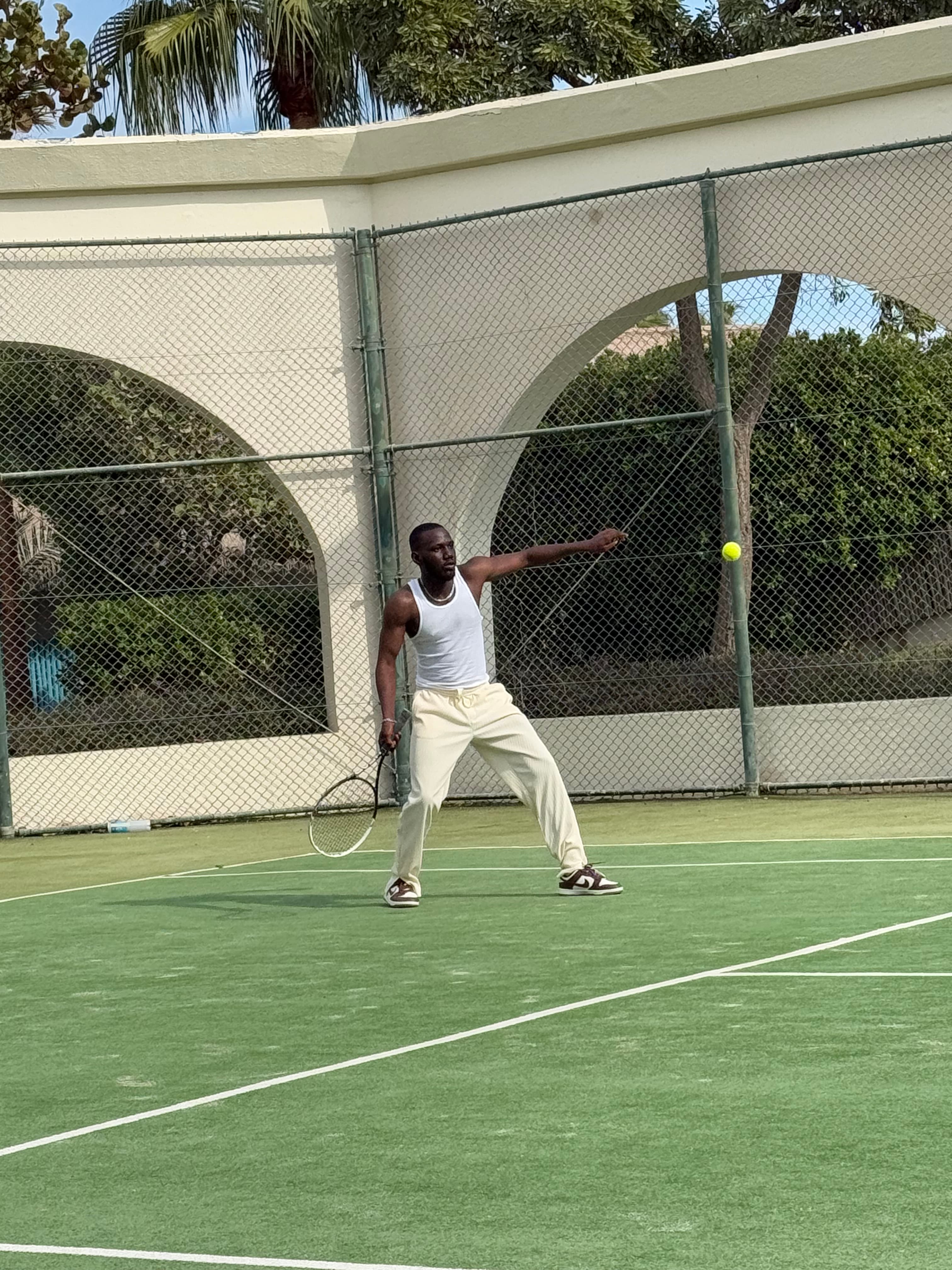 Favour playing tennis outdoors