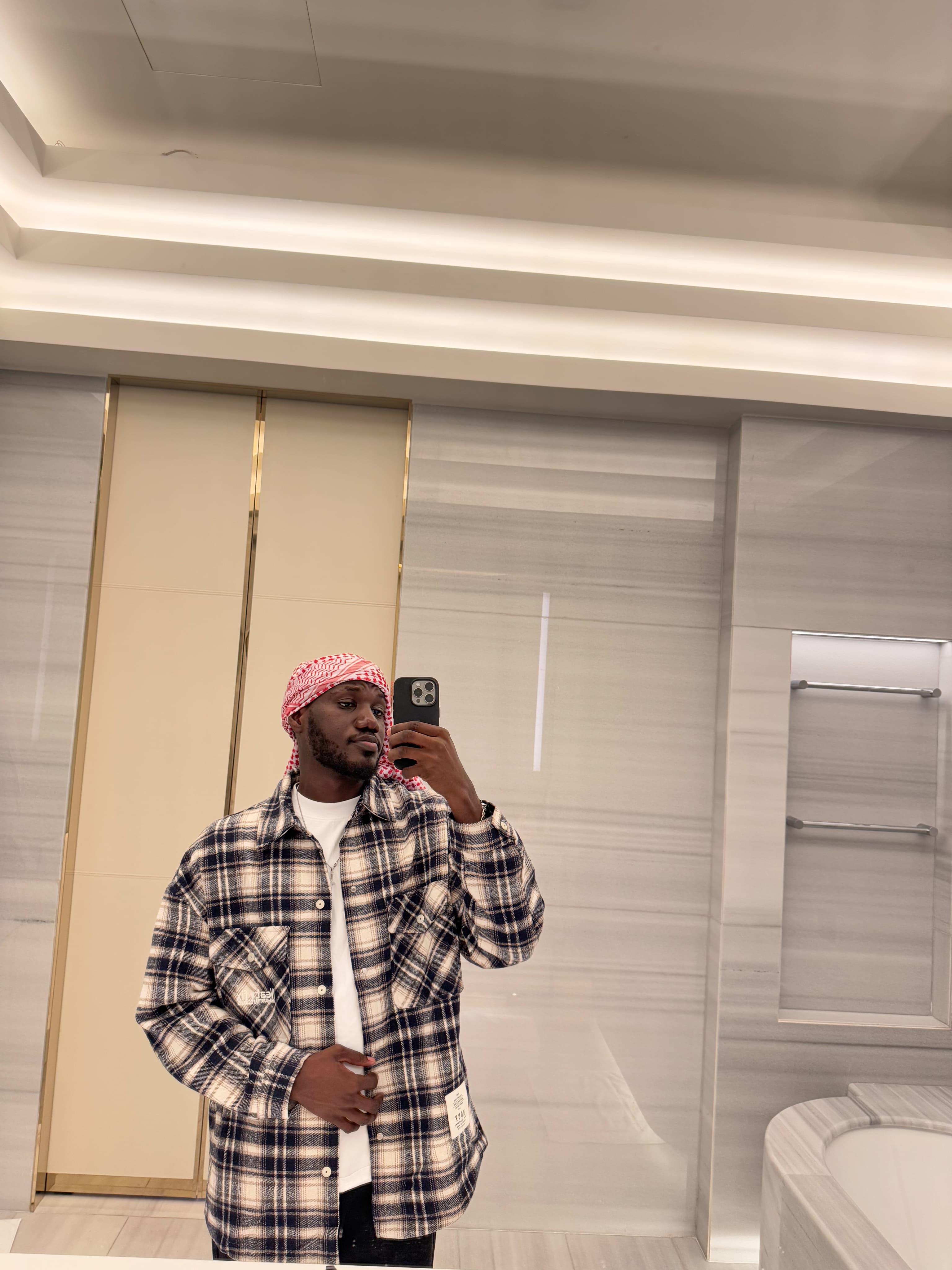 Portrait of Favour in a plaid jacket